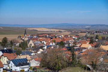 Fototapeta na wymiar The town of Siefersheim/Germany in Rheinhessen surrounded by vineyards in spring 