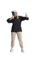 Happy beautiful young woman, lady-cook, chef in black uniform isolated on white background. Cuisine, profession, business, food, taste, restaurant concept.