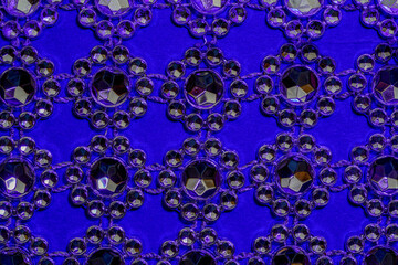 Glittering stones as a background photographed in the studio in long exposure