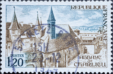 France - circa 1972: a postage stamp from France , showing the buildings of Charlieu Abbey