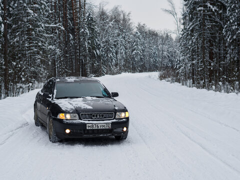 audi a4 b5 on a winter forest road. Bryansk, Russia - January 26, 2022