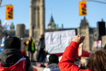 Clenched raised fist at Canadian trucker street protest in Ottawa