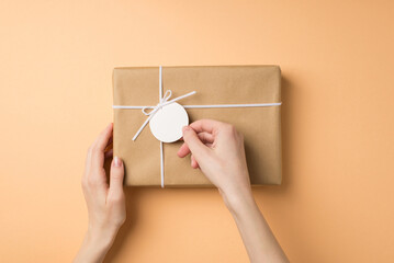 First person top view photo of valentine's day decorations girl's hands touching pricetag on craft...