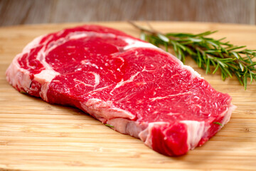 Raw Steak on Wooden Board. High quality photo