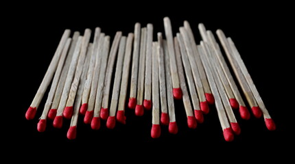 Fire matches pile isolated on black  