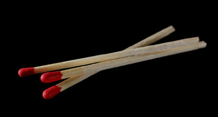 Fire matches pile isolated on black  