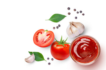 Tomato ketchup sauce with garlic, black peppercorn and basil leaf isolated on white background. Top view. Flat lay.