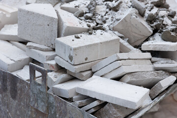 broken brick and the remains of a gas block at the construction site. Unused building materials -...