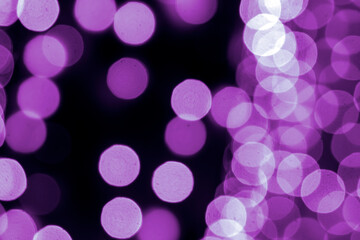 background blurred abstraction of colored lanterns and decorations. bokeh texture of street colored lights