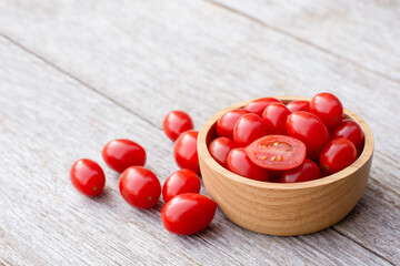 cherry tomatoes in a wooden bowl