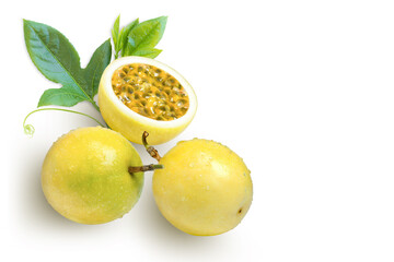 yellow Passion fruit (passionfruit) with water droplets and green leaves isolated on white...