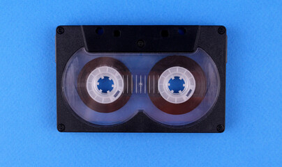 Audio cassette on blue background