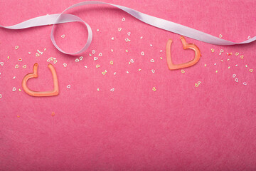 festive pink background with hearts