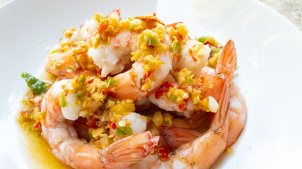 Spicy Shrimp Salad with Garlic chilli fish sauce and lemon in a plate