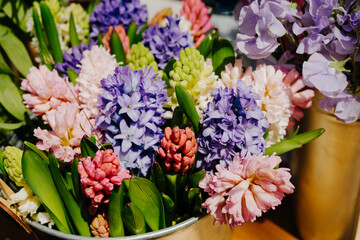 Flower shop. Sezhie flowers in iron buckets are sold on the market. Bouquet of hyacinthus and lathyrus odoratus.