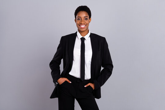 Photo of young cheerful man woman arms in pocket confident wear tux isolated over grey color background - Powered by Adobe
