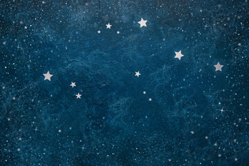 Astronomical Celestial pattern Constellation Aquarius from star shape silver confetti on the blue background.