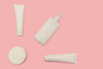 Cream and lotion in a white plastic container for skin. Close-up.