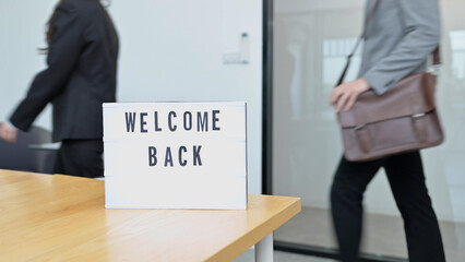 Young business people come back to office, Welcome back concept - 486101177