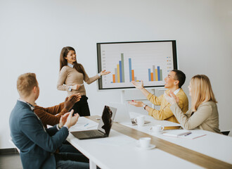 Group of multiethnic business people working together and preparing new project on a meeting in office