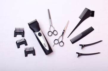 Barber clipper,scissors for haircuts,nozzles for haircuts on a white background.Free space for text.Barber tool.Copy space.