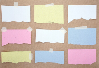 Multicolored torn note papers stuck with sticky tape. A collection of nine different pieces of paper sheets. Mockup for design. Blank templates for text.