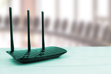 Black wlan and internet router on table.