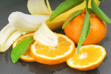 mandarin orange with leaves and banana macro details