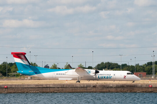 Luxair airplane (Bombardier DHC-8-400) roll on the London City Airport runway before take off