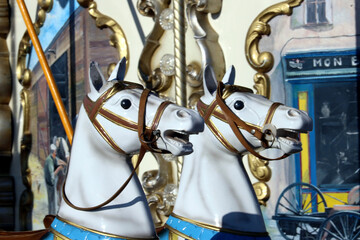 Fototapeta na wymiar carousel horses in the park