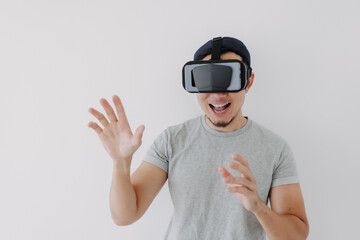 Asian man wears virtual glasses for interactive virtual meta world technology.