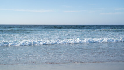 Raging ocean waves. Raging waters. White bureaucratic waves of the sea. Abstract blue sea water with white wave
