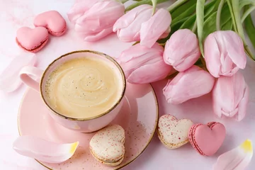 Poster Vintage pink coffee cup, tulip flowers and french sweet cookies macarons macaroons  on marble background © BarTa