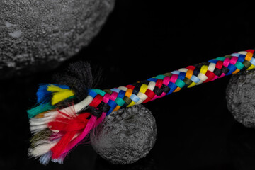 Textile accessory or colored threads drawn on a black background. colored knitting yarn