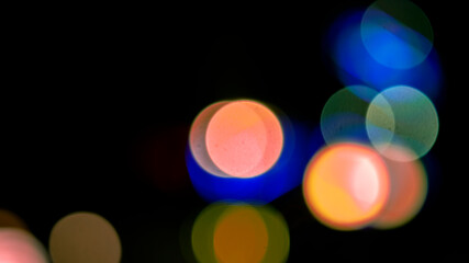 background blurred abstraction of colored lanterns and decorations. bokeh texture of street colored lights