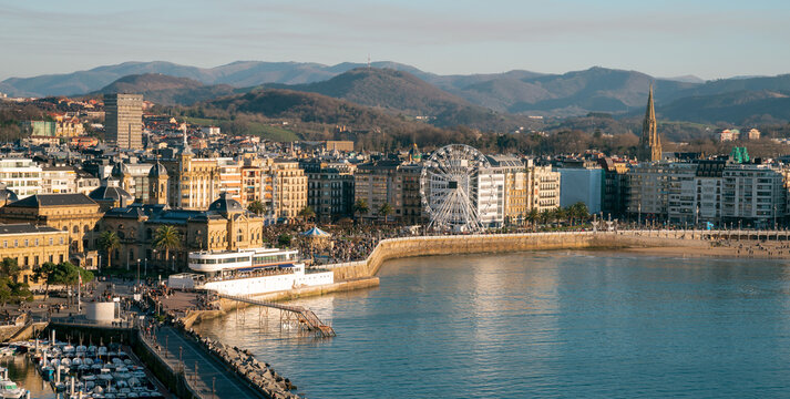 View of San Sebastian Donostia at sunset. View of the Alderdi Eder, the City Hall Nautical Club and the Ferris wheel.