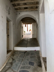 Fototapeta na wymiar old stone corridor in Naxos, Greece