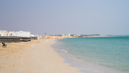 Multiple tents in the Qatar Fuwairit beach during the winter beginning season.