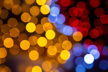 background blurred abstraction of colored lanterns and decorations. bokeh texture of street colored lights