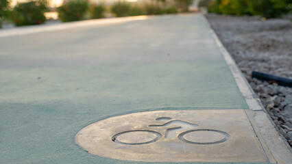 Bicycle track with bike sign embedded on it.