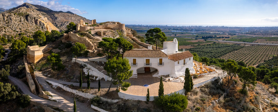 High angle panoramic view of Hermitage of La Magdalena and Old Castle ruins on top of the hill in Castello 