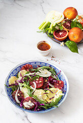Detox Buddha bowl with avocado, blood orange, nuts, red cabbage arugula and fennel