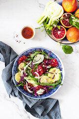 Detox Buddha bowl with avocado, blood orange, nuts, red cabbage arugula and fennel