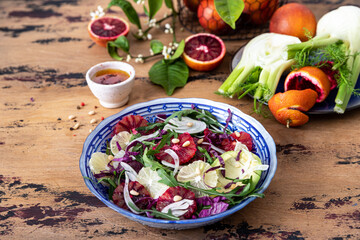 Detox Buddha bowl with avocado, blood orange, nuts, red cabbage arugula and fennel