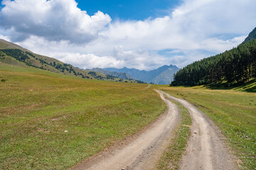Fototapeta na wymiar View in Mountains. Road to Shenako village from Diklo in Tusheti region