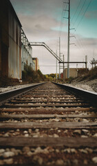 Fototapeta na wymiar Train tracks through industrial area