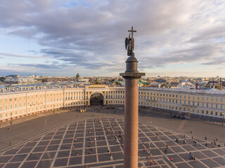 Aerial view of Palace Square and Alexander Column at sunset, a dome of Kazanskiy Cathedral on...