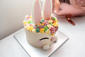 Trendy cake for children's Birthday party or Ester. Cheerful bunny with a muzzle and ears....