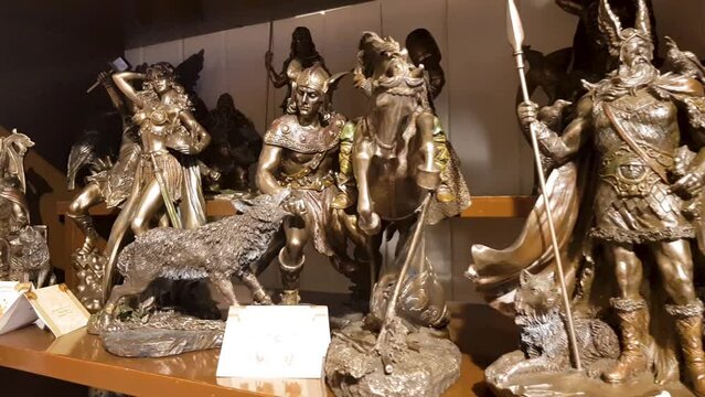 Norse mythological gods figurines arranged on a store shelf