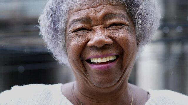 A joyful older black woman authentic smile real happy expression